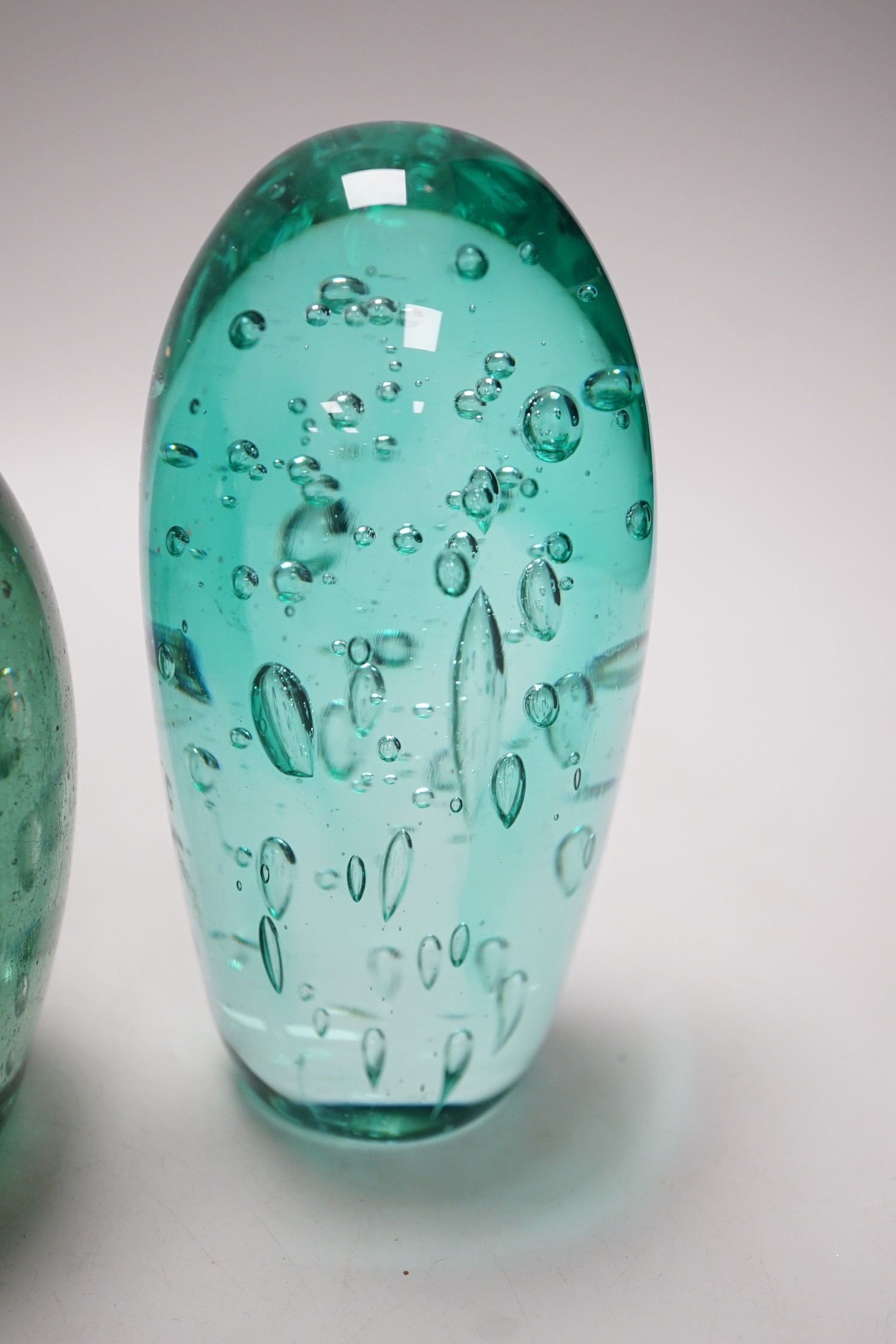 Four 19th century green glass dumps, one floral, tallest 16cms high